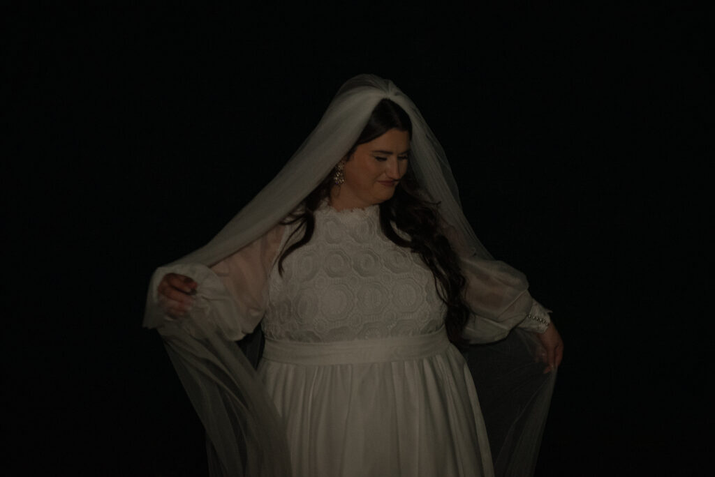 Cinematic bridal portrait taken during a Texas Hill Country elopement at night