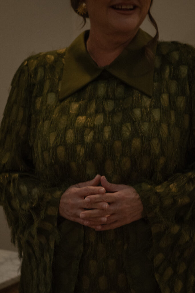 Candid family moment during wedding day getting ready, captured in a warm, documentary photography style.