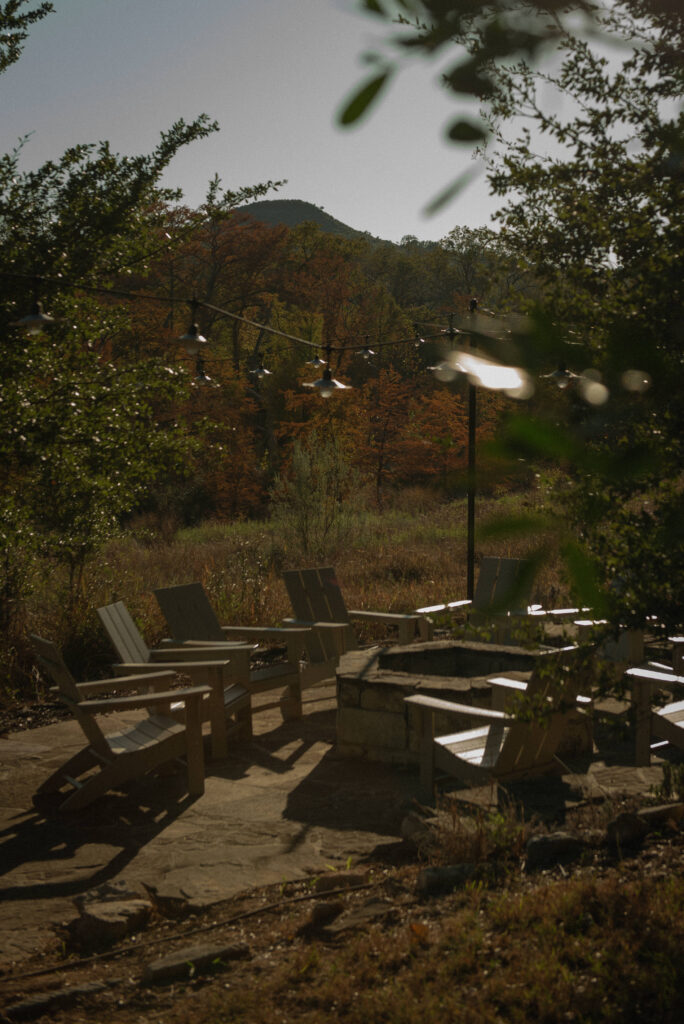 Outdoor Texas Hill Country elopement ceremony site in Wimberley, Texas surrounded by fall foliage.
