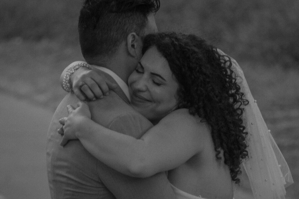 Black and white portrait of a couple hugging after a Houston courthouse elopement