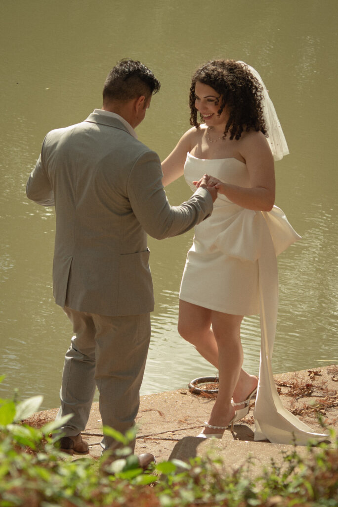 Couple holding hands during Buffalo Bayou portraits after a Houston courthouse elopement.
