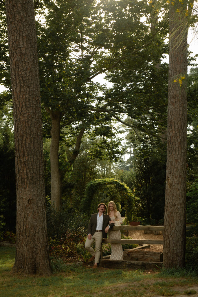 Engaged couple posing together at Mercer Botanic Gardens during a summer engagement session in Houston Texas