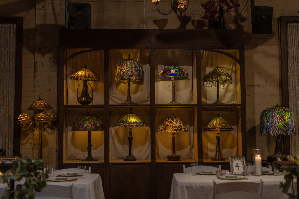 Decorative stained-glass lamps inside Nouveau Antique Art Bar in Houston.