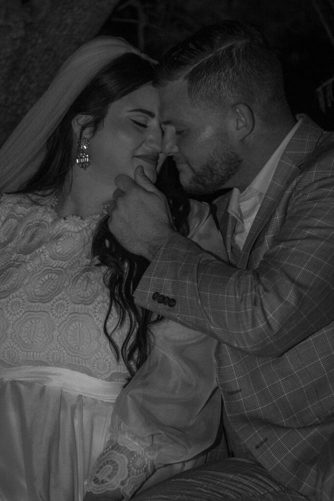 Black and white close up of a couple embracing during a romantic Hill Country elopement