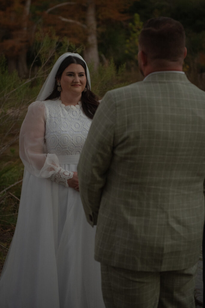 Intimate outdoor elopement ceremony with couple exchanging vows in the Texas Hill Country