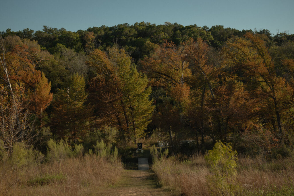 Scenic pathway leading to an intimate elopement ceremony location in the Texas Hill Country near Wimberley.