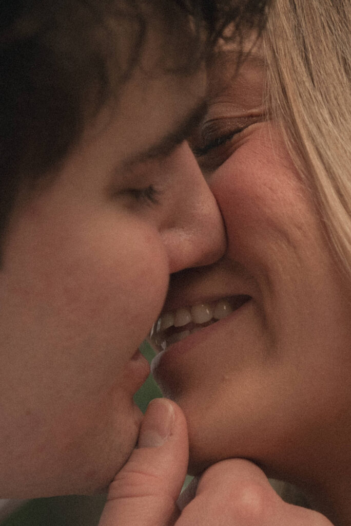 Close-up of an engaged couple smiling during an outdoor engagement session in Houston.